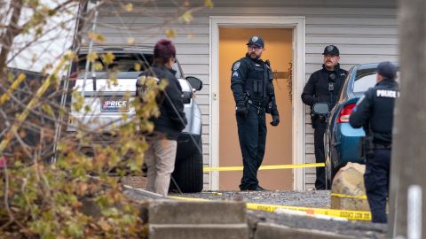 Idaho police say there were other people in the home at the time of quadruple homicide, but declined to say who called 911